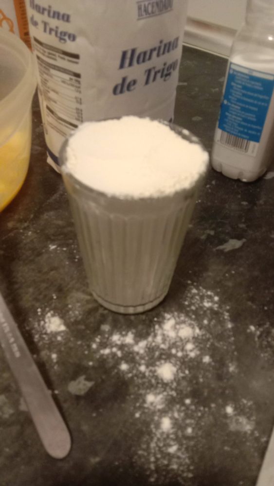 a good old glass o' flour with more flour spilling out