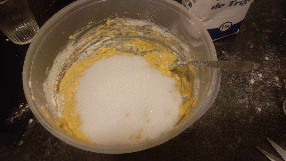 sugar poured over cake dough