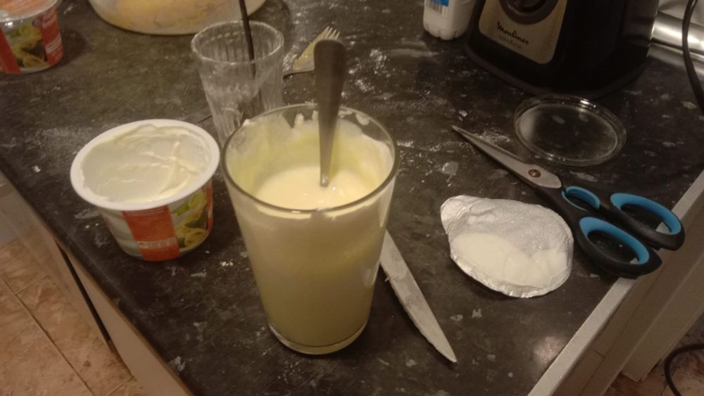 white creamy mass in a large, tall glass with a spoon sticking out of it :D