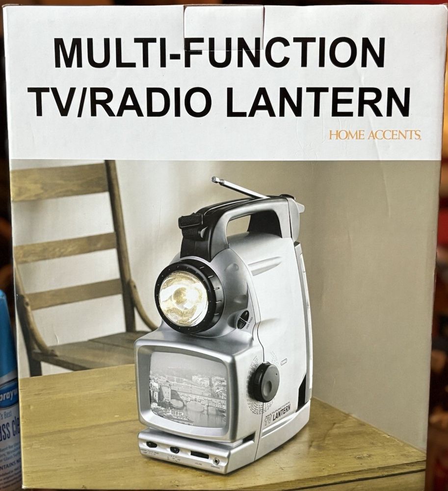 Photo of a box for "MULTI-FUNCTION TV/RADIO LANTERN" that is real!! It's a flashlight with a black and white TV set in one unit.