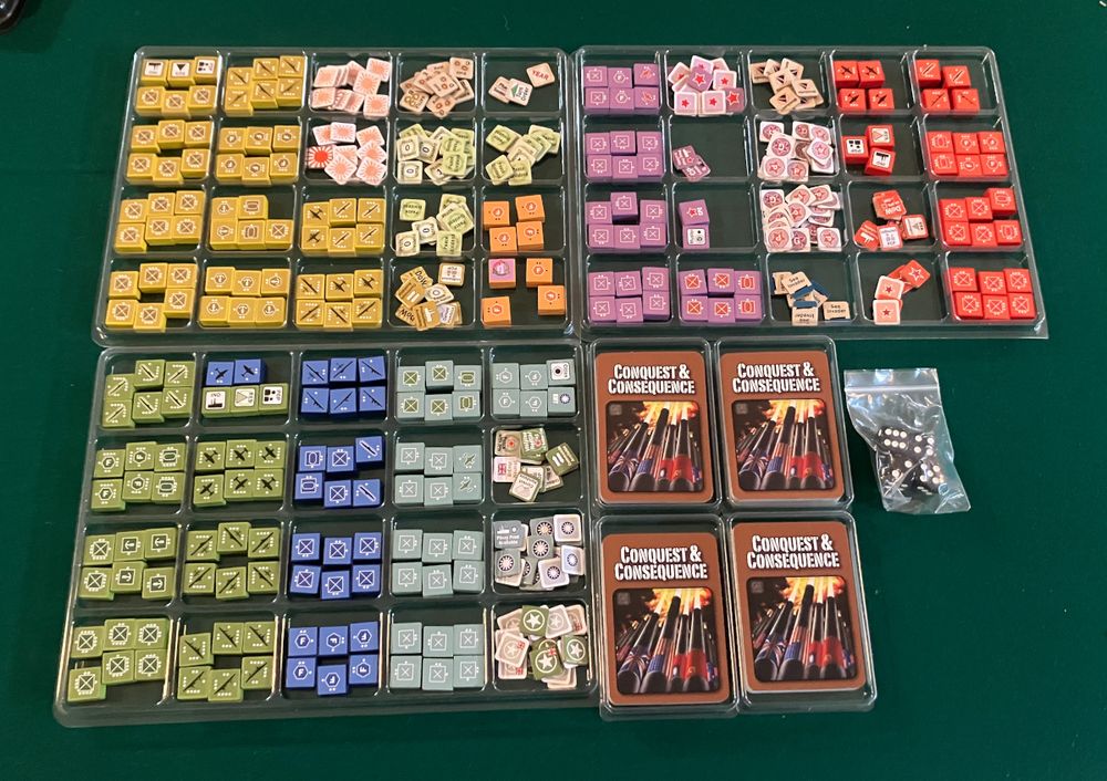Conquest and consequences game components organized to plastic trays.