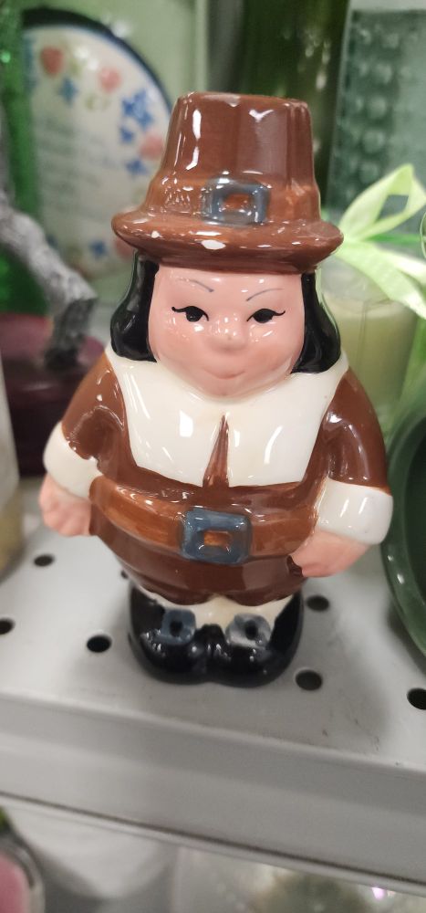 Pilgrim salt shaker with phenotypically Asian features.