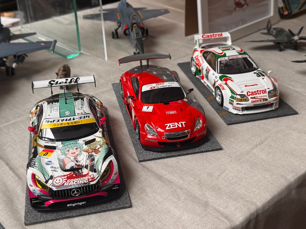Three 1/24 scale model race cars - a Mercedes AMG GT3, Lexus SC430, Toyota Supra
