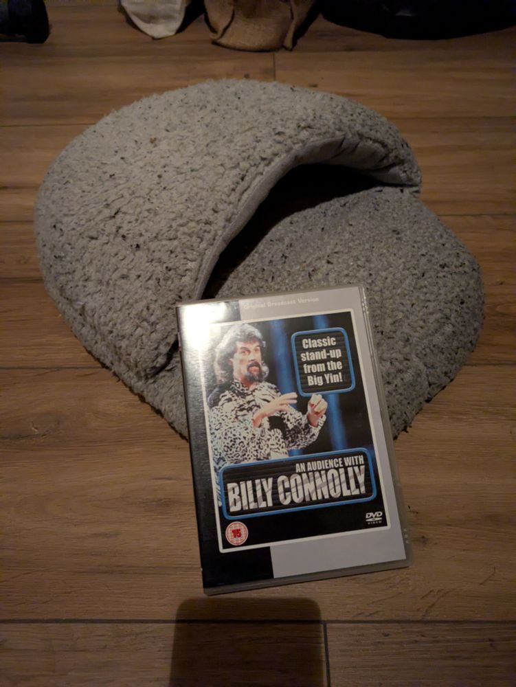 A picture of An Audience With Billy Connolly DVD and a big slipper.