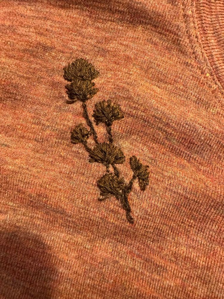 Close-up of an embroidered gingko leave 