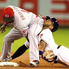 baseball player Jonathan Villar sliding into other baseball player Brandon Phillips's ass. Is it Phillips's or Phillips'? Leave a comment. 