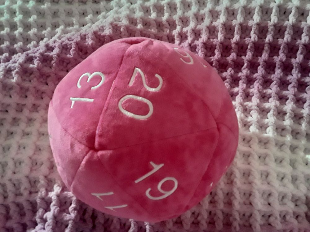 A plush of a 20-sided dice