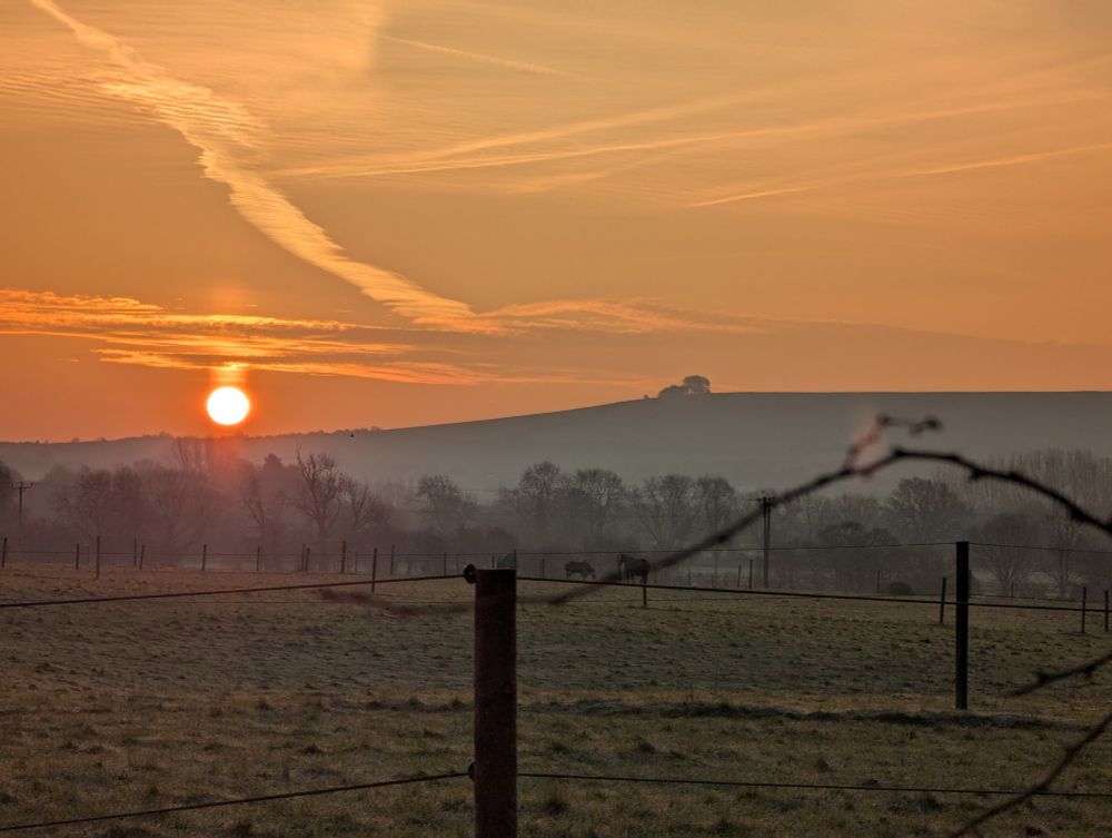 View of Liddington from Coate Water Country Park sunrise winter 2025