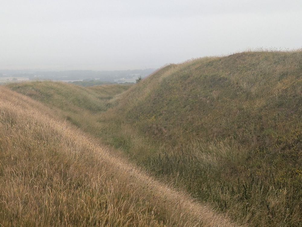 View along the ditch on Liddington Castle, Hill fort in North Wiltshire, July 2025