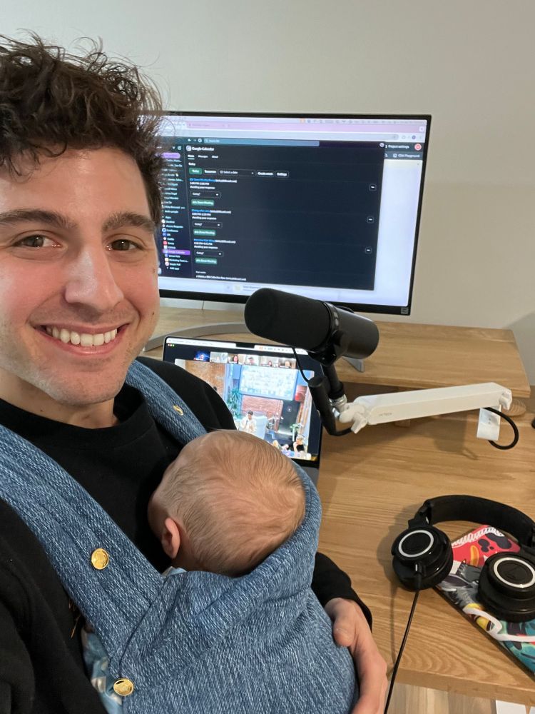 Father and son in front of computer setup