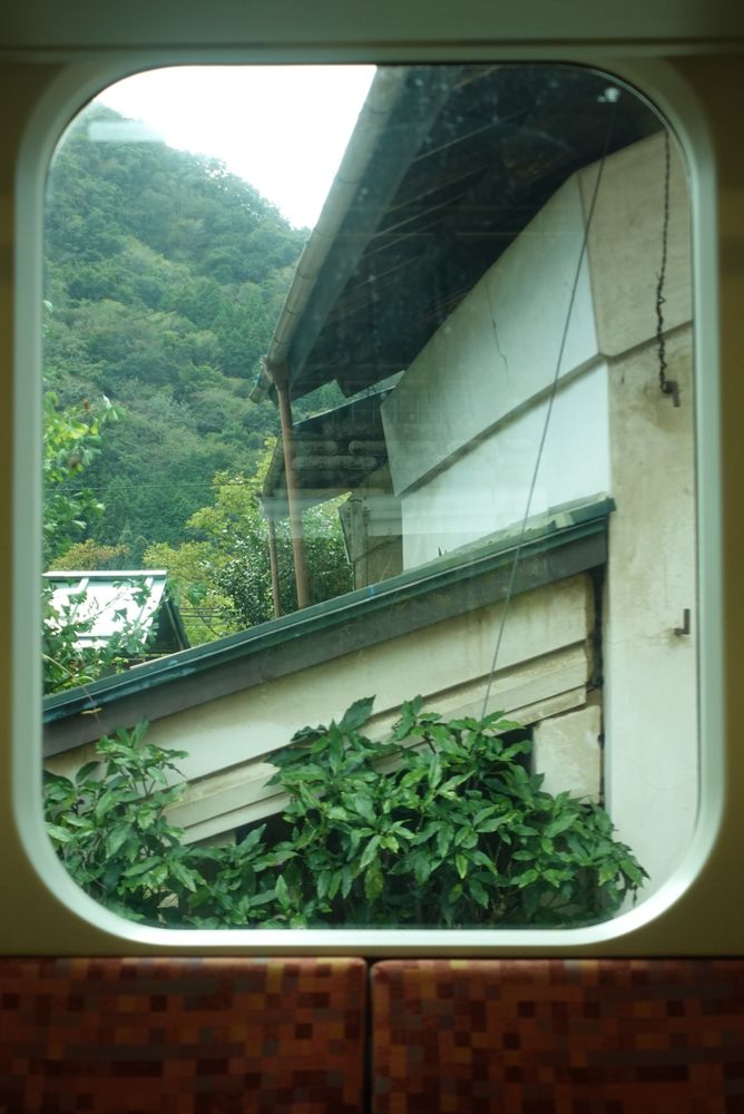 Regular passenger train window I took also the train was empty so I didn't disrupt anyone. not the best photo but new people came in the train after this shot so I got nervous (area otw to yamanashi)
