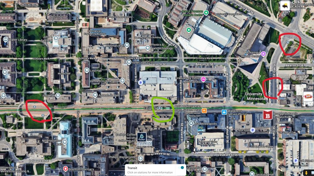 Google satellite view of the University of Minnesota east bank campus with heavy density and totally disjointed transit stops angrily circled by me. 