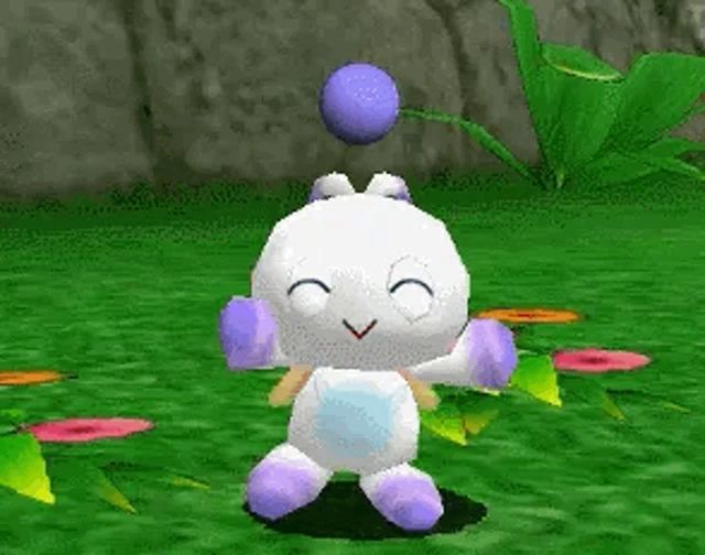 a white and purple cartoon character is standing in the grass with a purple ball on his head .