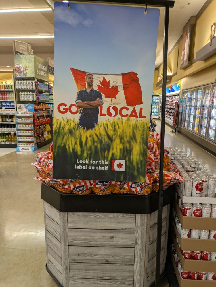 Grocery store sign "Go Local" with Canadian flag: look for this label on the shelf