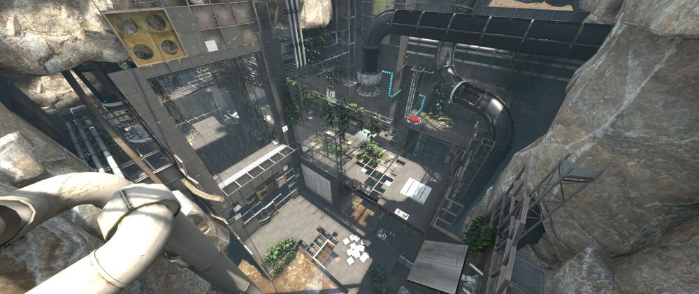 A ruined test chamber from Portal: Revolution. The scene is chaotic, with lots of exposed rebar covered in plantlife. Multiple large tubes are running throughout the image, and can be seen going into the surroundimg rock walls. Various testing elements are scattered about, such as buttons, antlines, and deadly goo.