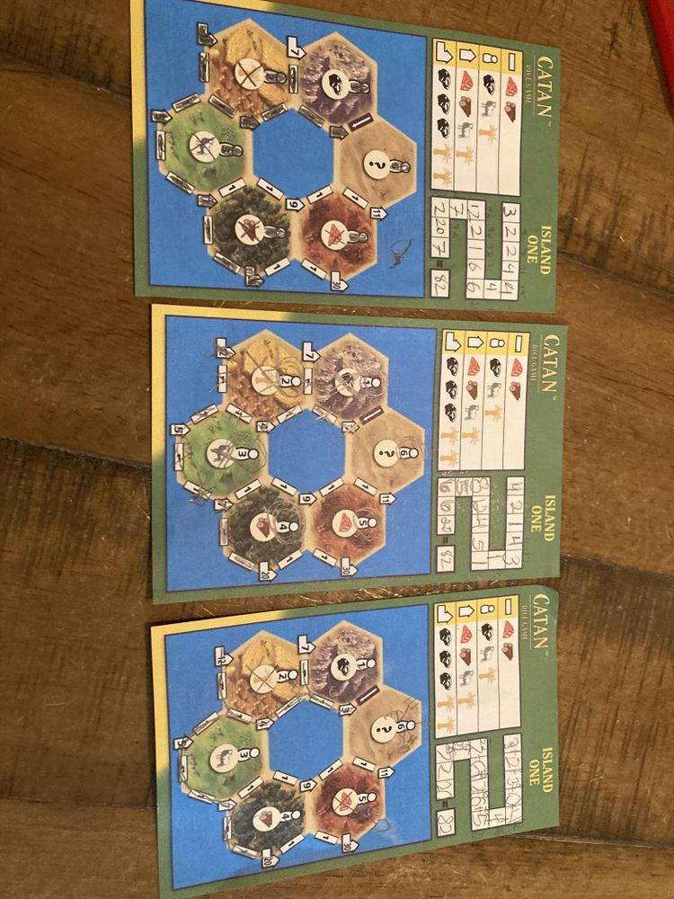 Three catan score sheets that all add up to 82