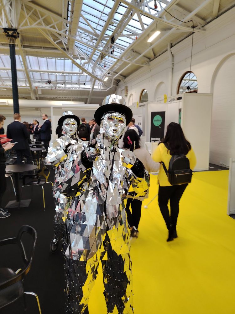Two people dressed as mirrorballs
