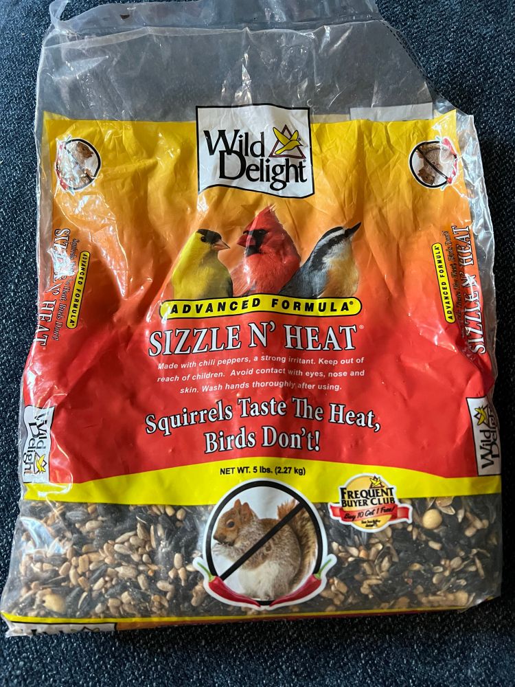 A birdseed brand that notes the seed as being sizzle and heat, meaning it’s treated with hot pepper oil to deter rodents from invading your feeder