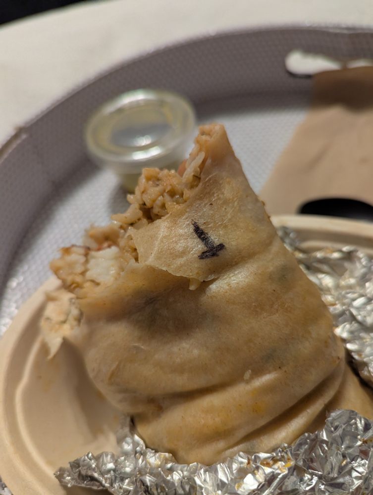 Someone somehow drew a T in marker on a burrito. Seriously how do you do that.