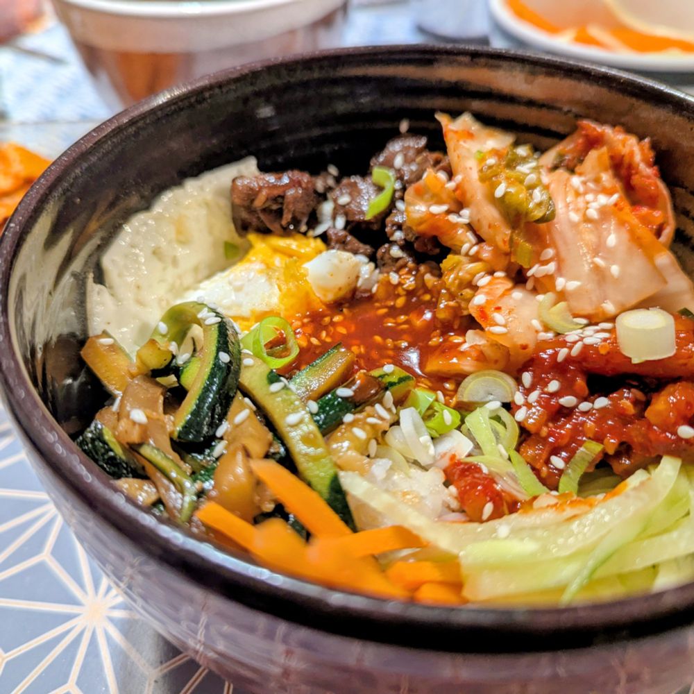 À brightly colored bowl of bibimbap 