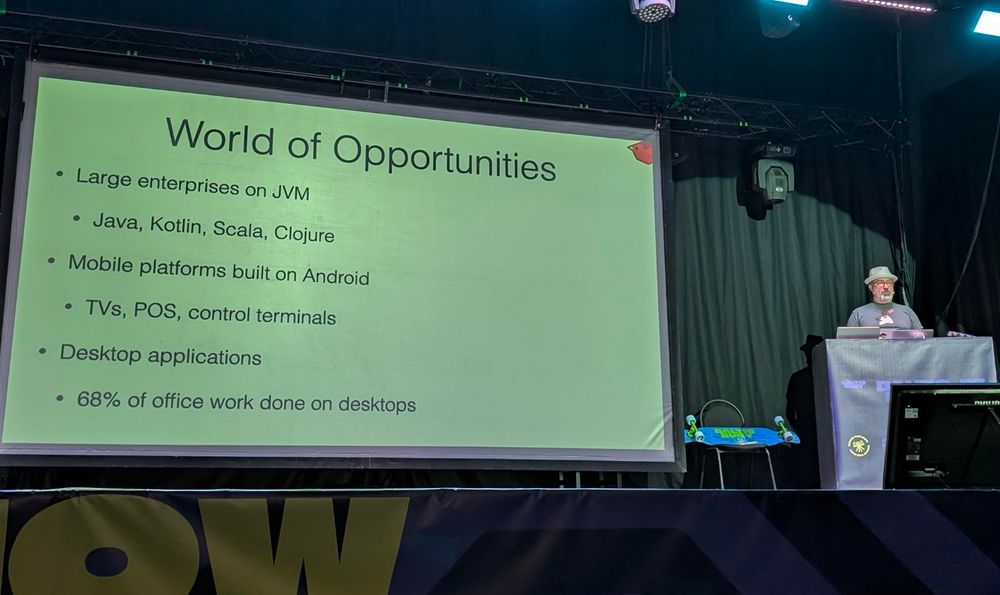 Charles Nutter presenting a slide with different use cases of JRuby