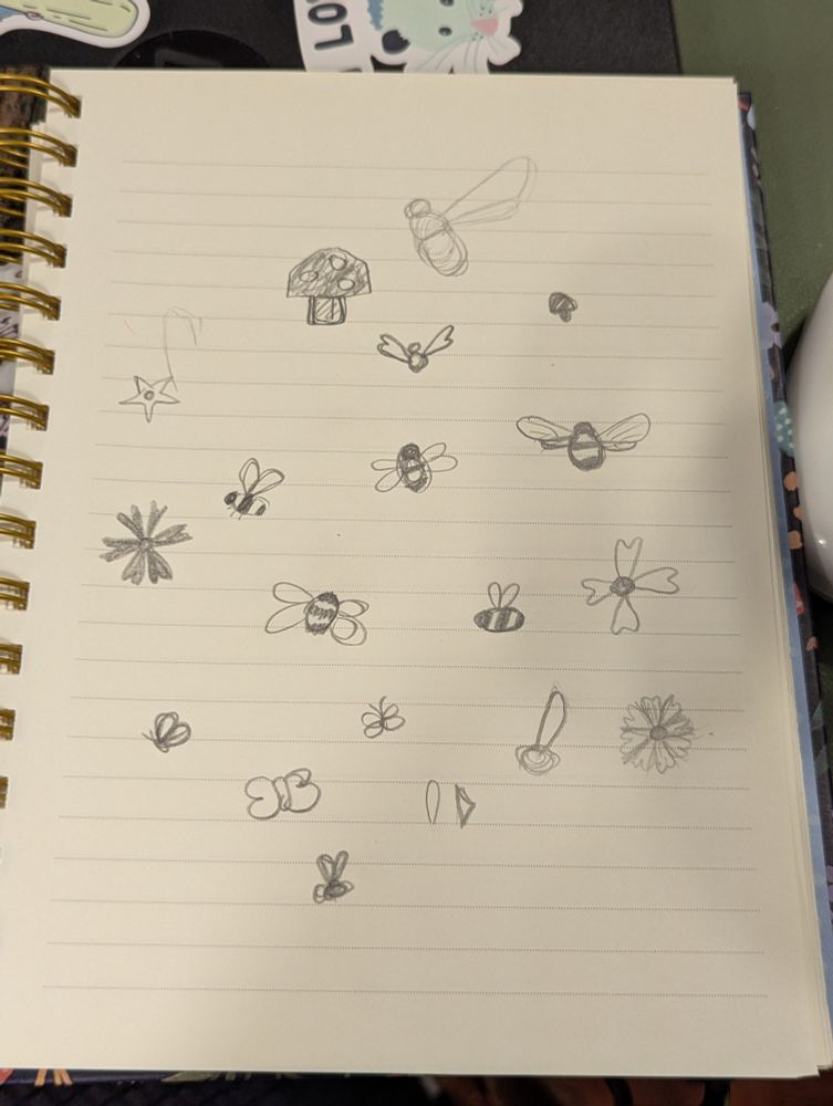 A lined notebook page with lots of small pencil doodles, mostly of different tiny stylized bees.