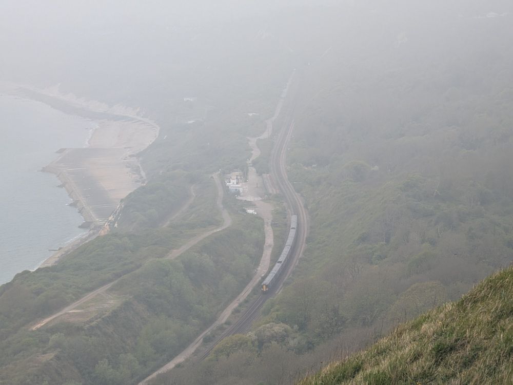 A class 375 travels along the coastal route, taken from the cliff top path. 
