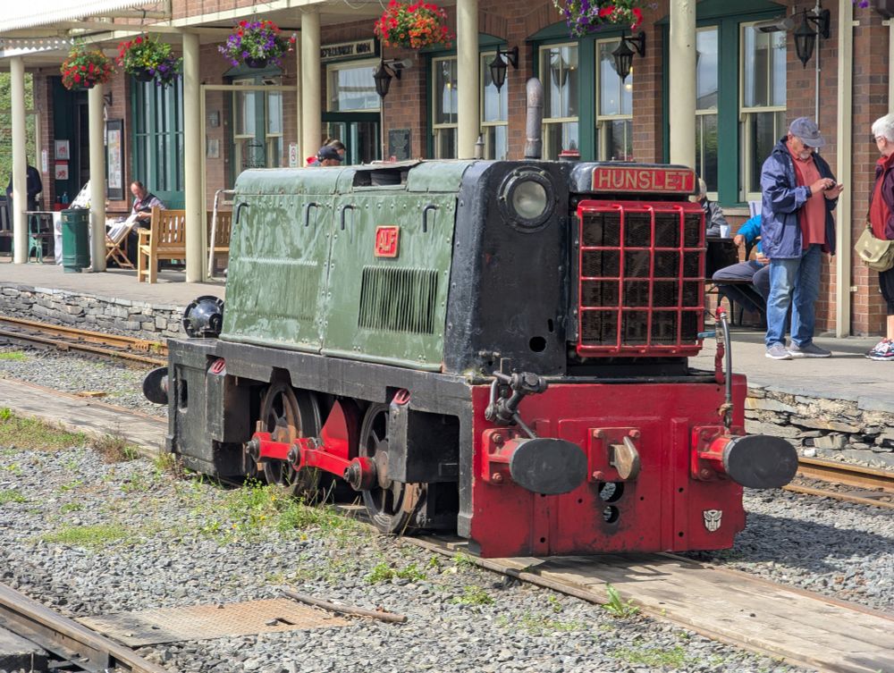 Cab-less loco Alf in the run round at Tywyn Wharf, station building in the background 