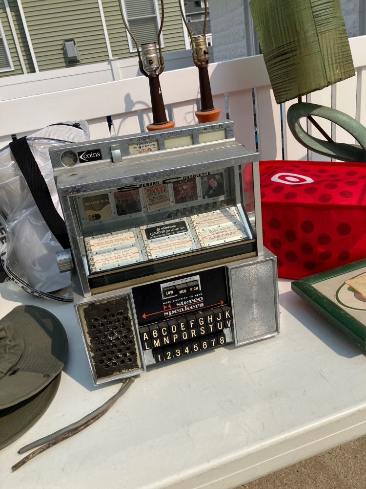 a small tabletop jukebox made by seeburg consolette