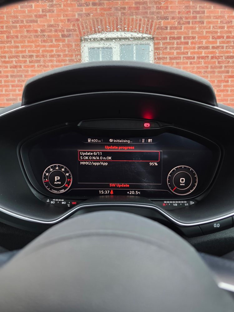 Car dashboard showing software update information 
