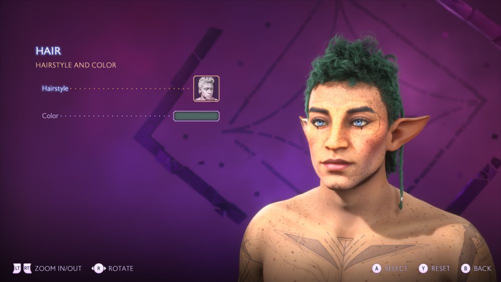 Close up on Rook Deygan's bust. Deygan has a dark green curly mullet with a padawan braid falling behind his left elven ear. They have bright blue eyes with dark under eye makeup. A plethora of freckles cover their face as well as a faded geometric tattoo design down the center of their face. Freckles continue to cover the chest as well as another tattoo on the upper chest, and parts of two others on the upper part of each arm.