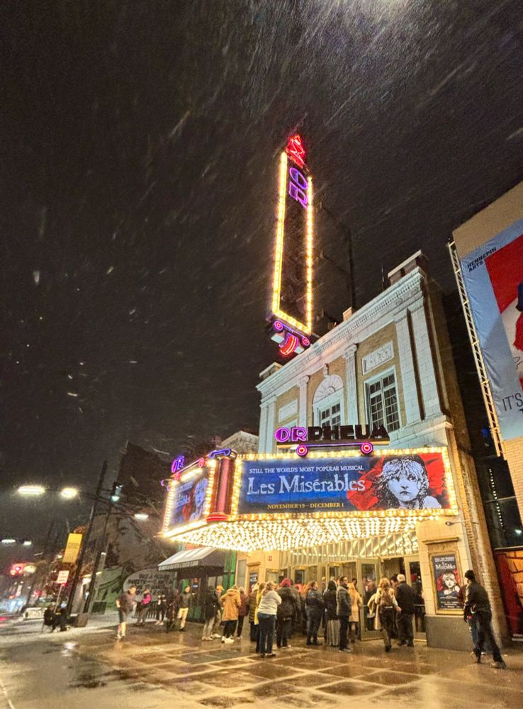 people in line to get into the orpheum theatre for an evening performance of les miserables on a snowy wednesday night 