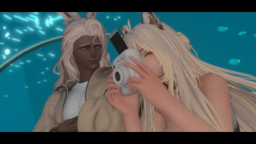 Octavious and Sadie enjoying their date at an aquarium 