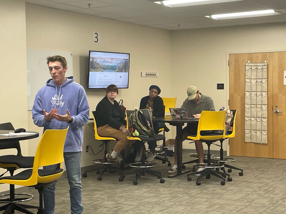Evan Younger presenting his curriculum work on industrialization in World History