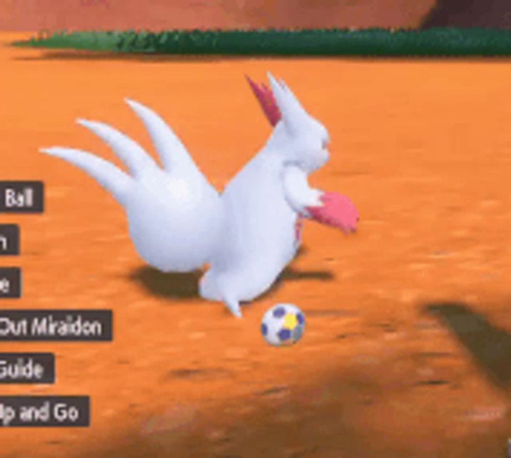 a white rabbit is playing a video game with a soccer ball