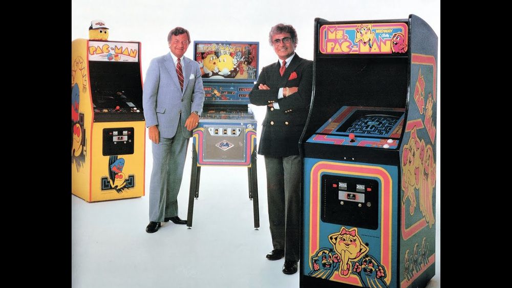 1982-05-22 Cash Box cover. Stan Jarocki (right) stands with Charles Farmer around cabinets of Ms. Pac-Man, Pac-Man, and Mrs. and Mrs. Pac-Man.
