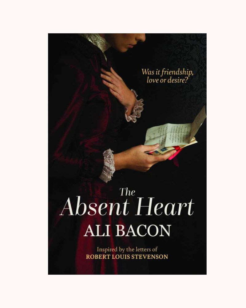 Image shows cover of The Absent Heart: a woman in Victorian dress holds a letter, one hand on her heart