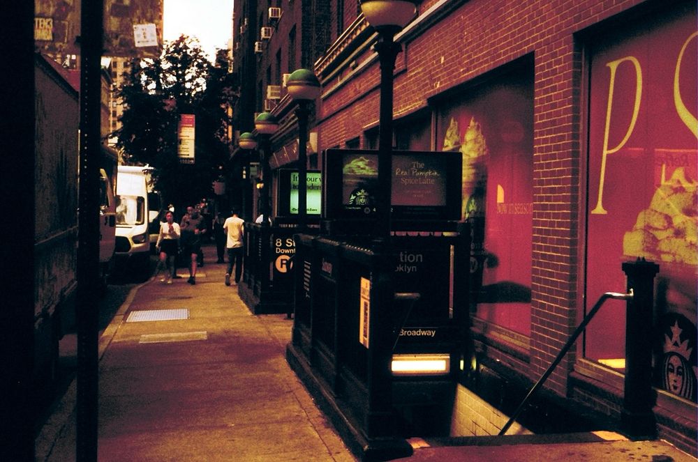 A subway entrance Very red-hued