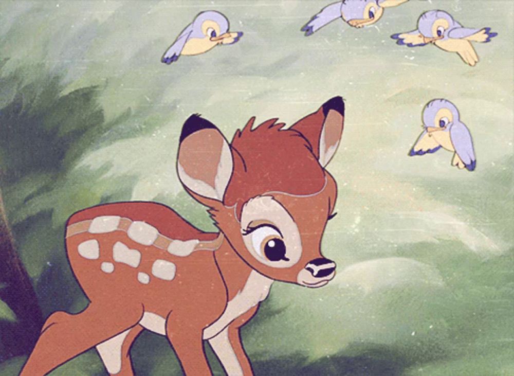 a cartoon drawing of a baby deer with birds flying around it