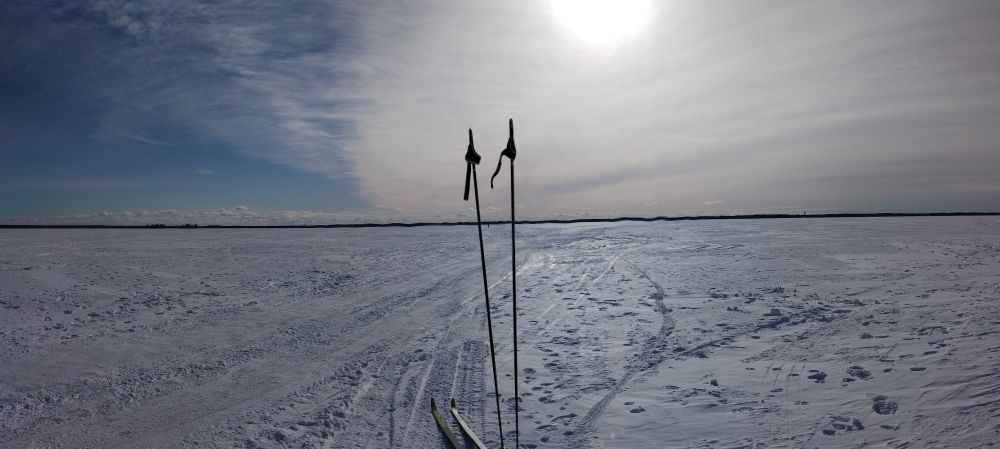 Fresh snow on an iced over bay. Skis ready!