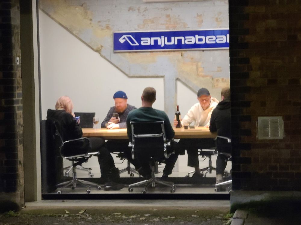 The EDM duo, 'anamē', having a business meeting from a street-side exposed window at Anjunabeats headquarters in Bermondsey