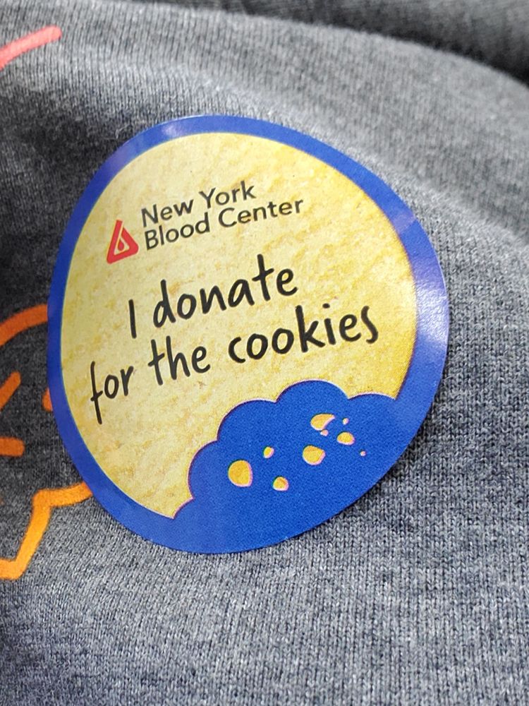 Sticker on my sweatshirt from the New York Blood Center that reads "I donate for the cookies."