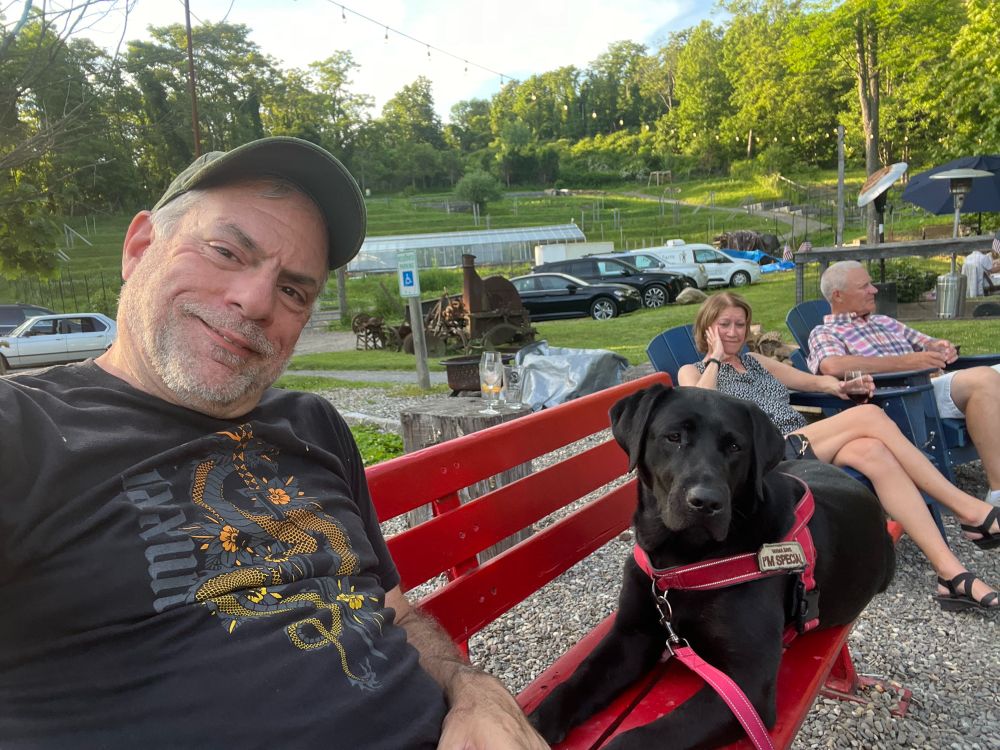 “Stevie Licks” and I sitting on a bench outside