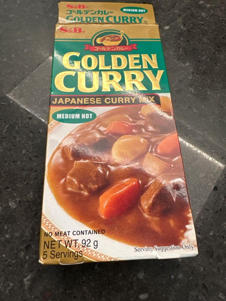 A packet of golden curry Japanese curry mix, medium hot.