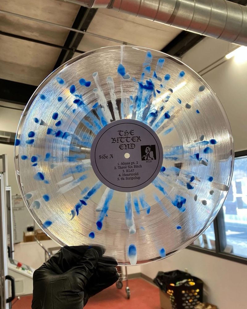 Clear vinyl with blue splatter by Hellbender Vinyl