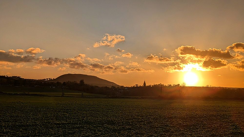 Winter sunset over East Linton, East Lothian and Traprain Law.