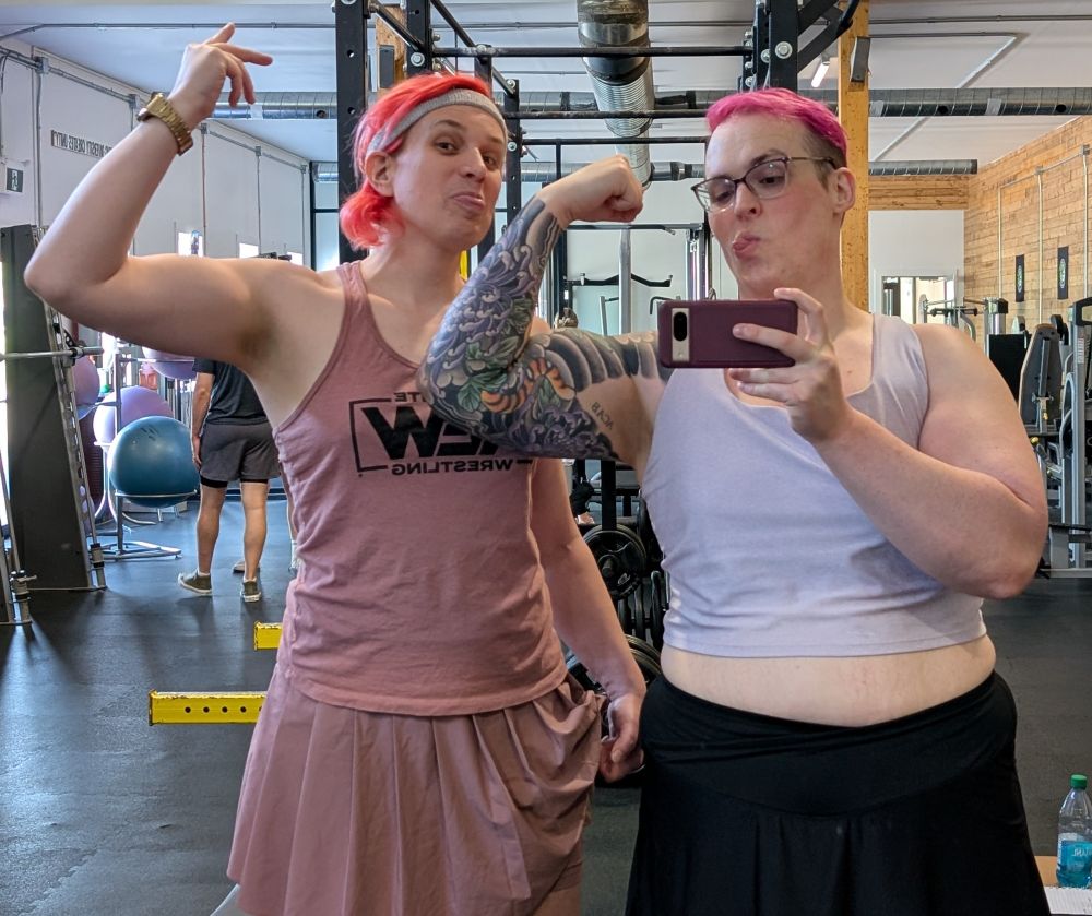 A picture of me and Eve Sandwich Pope flexing at the gym