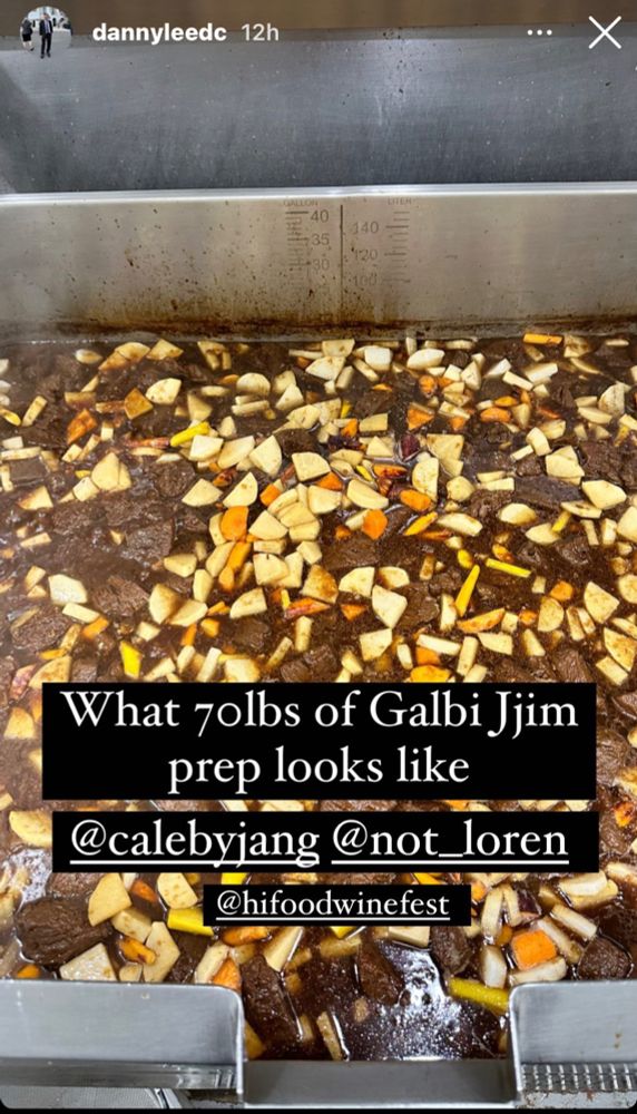 A photo of a 70 pounds of Galbi Jim preparation. A stew with lots of beef, potatoes, and carrots visible. The picture has the words “What 70lbs of Galbi Jim prep looks like” below it are tagged underlined profiles on Instagram @calebyjang @not_loren @hifoodwinefest