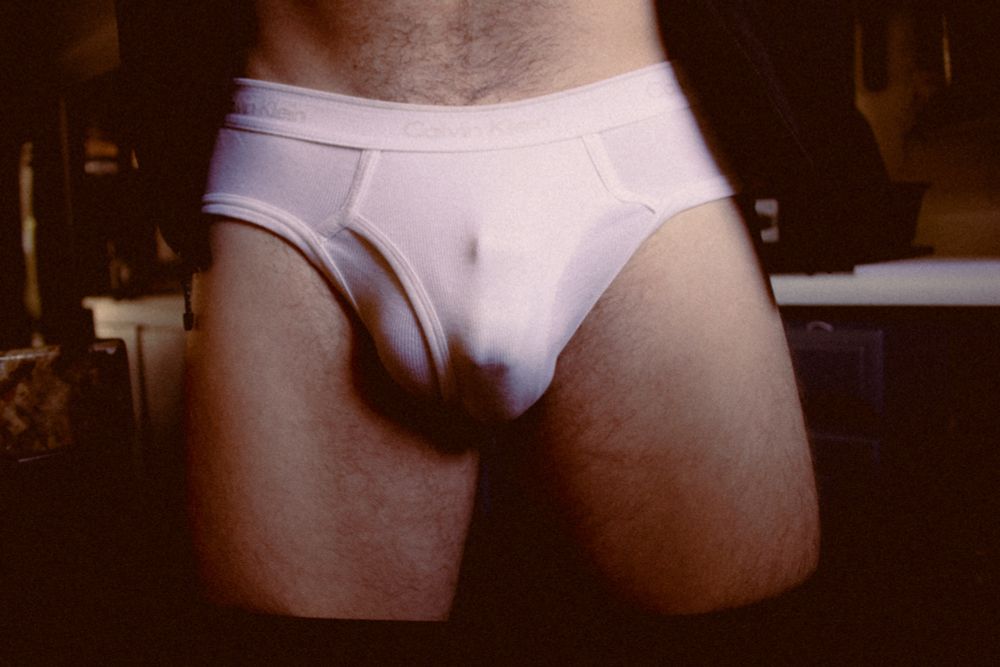 Guy in underwear locked in chastity cage