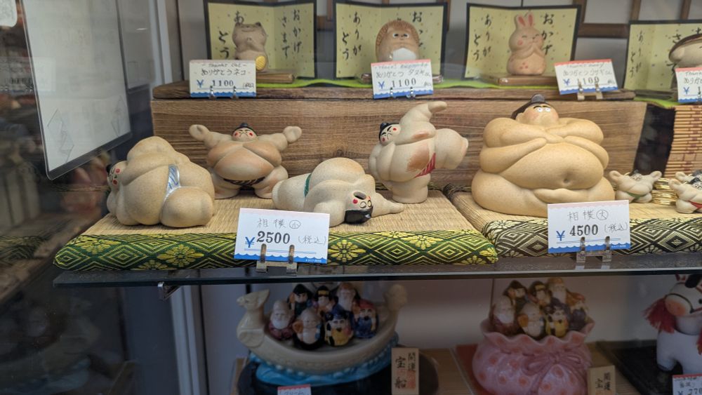 Figurines of very fat sumo wrestlers found at a shop in Asakusa, Tokyo, Japan